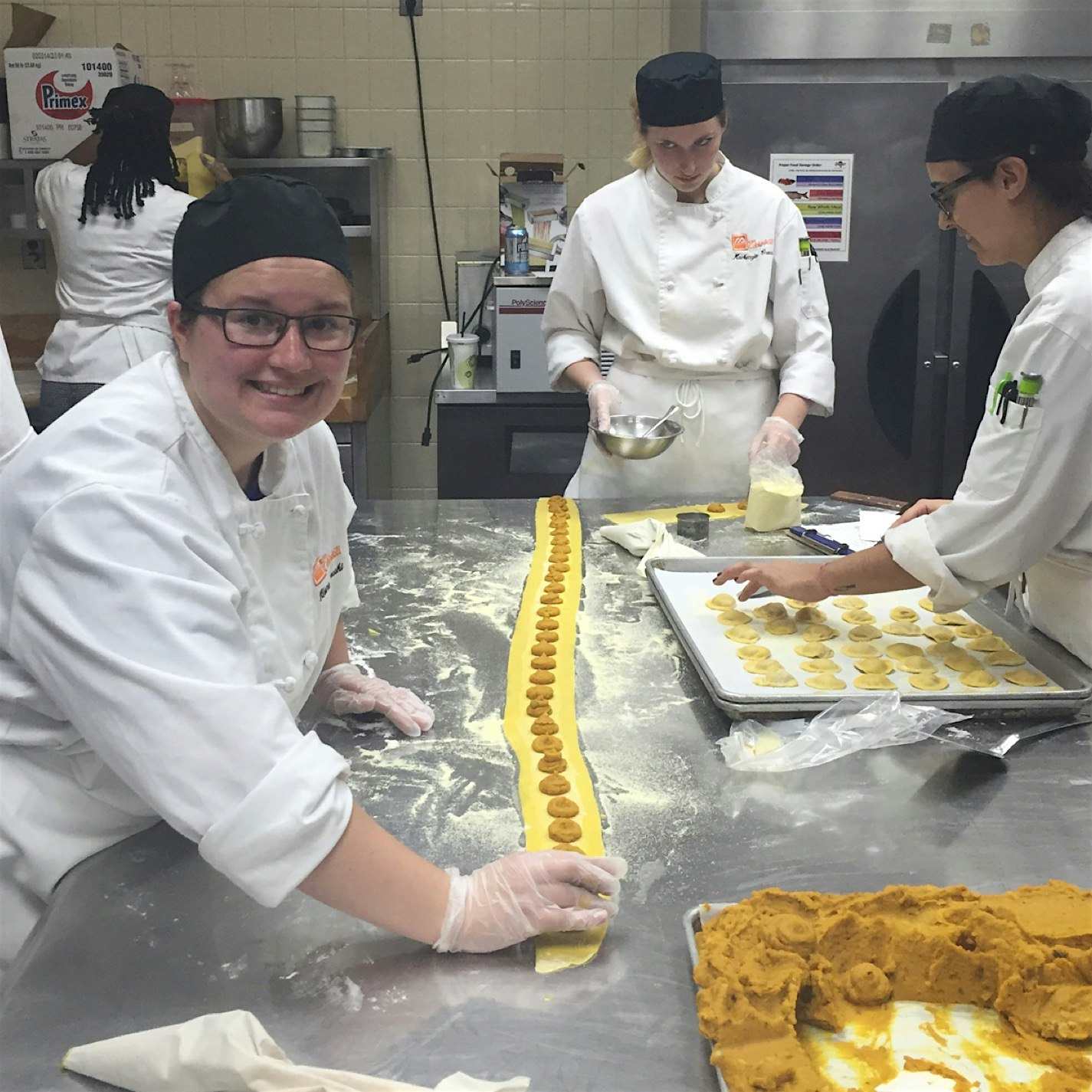 Squash and Red Lentil Ravioli with my Farm to Table class, prepping for our next dinner. 