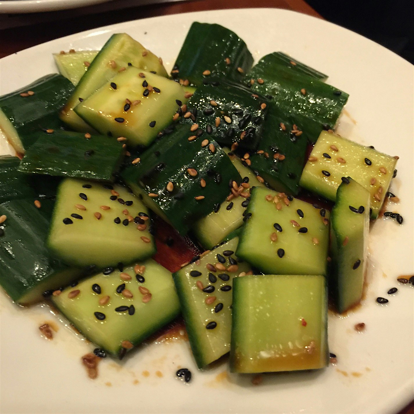Amazing cucumber salad! Cucumbers, soy sauce, and sesame seeds. Favorite dish of entire dinner!