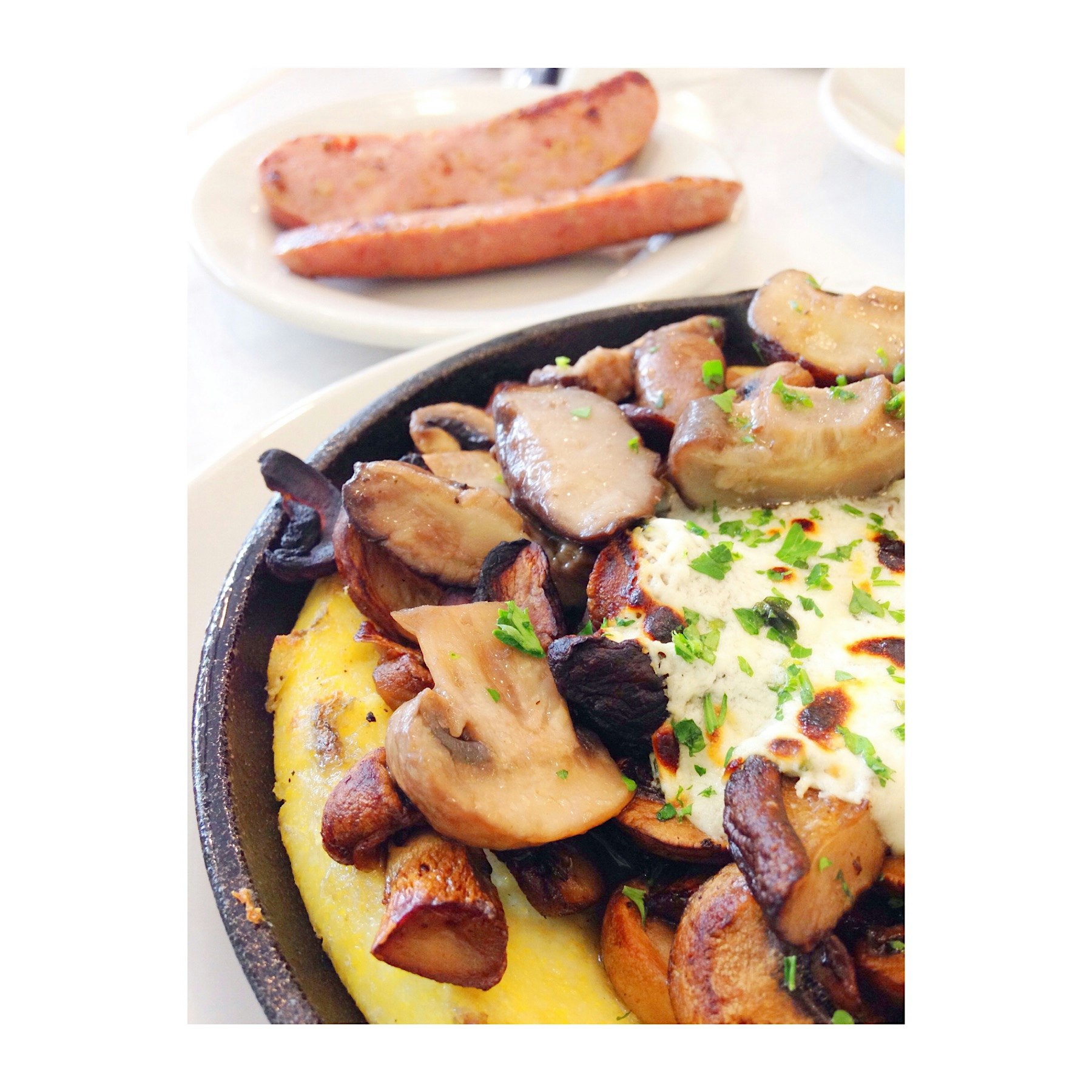 Polenta w/ roasted wild mushrooms, & herbed goat cheese. With a side order of chicken apple sausa...