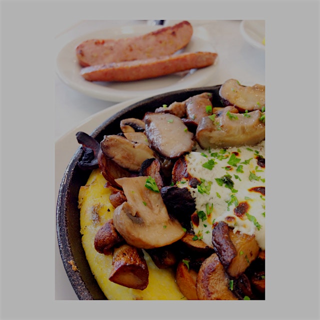 Polenta w/ roasted wild mushrooms, & herbed goat cheese. With a side order of chicken apple sausa...