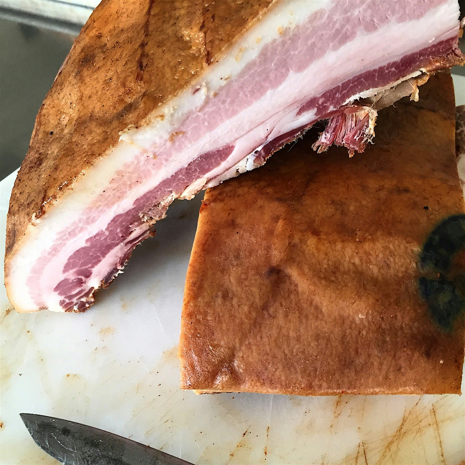 Finished bacon from SUNY Cobleskill pigs, processed, cured and smoked by my meat cutting class. 