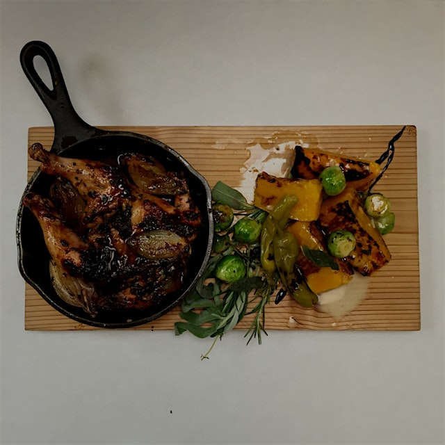 Roasted Poussin, ancho chilly glaze, brussel sprouts, honey butternut squash, topped off with som...