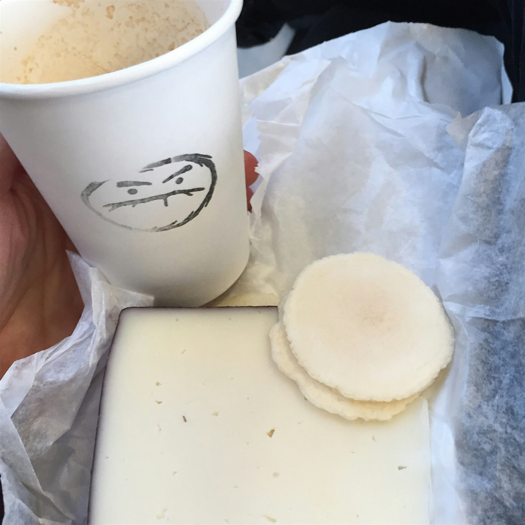 My lunch on the train. Cafe Grumpy plus Drunken Goat cheese and potato crackers from Murray's. At...