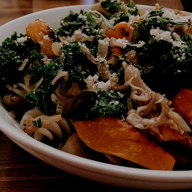 Roasted butternut squash with kale, shallots and maitake mushrooms over brown rice pasta for the ...