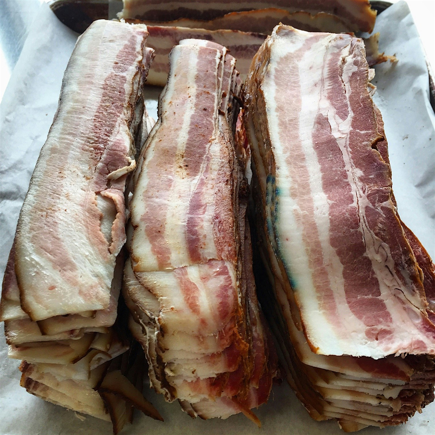 Sliced bacon from a campus raised pig.