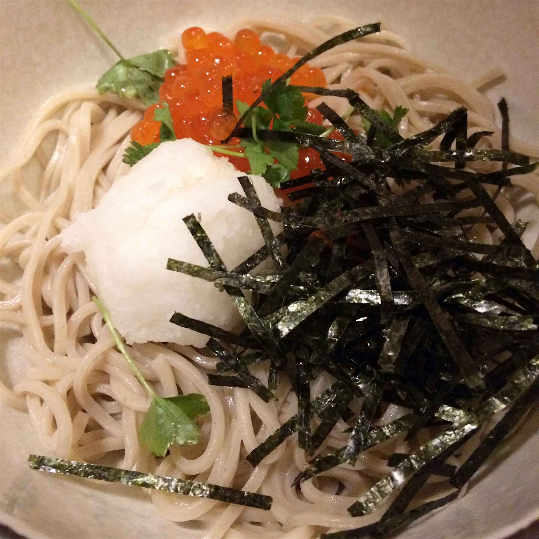 A refreshing bowl of soba - Buckwheat Noodles, topped with grated turnip and roe. 