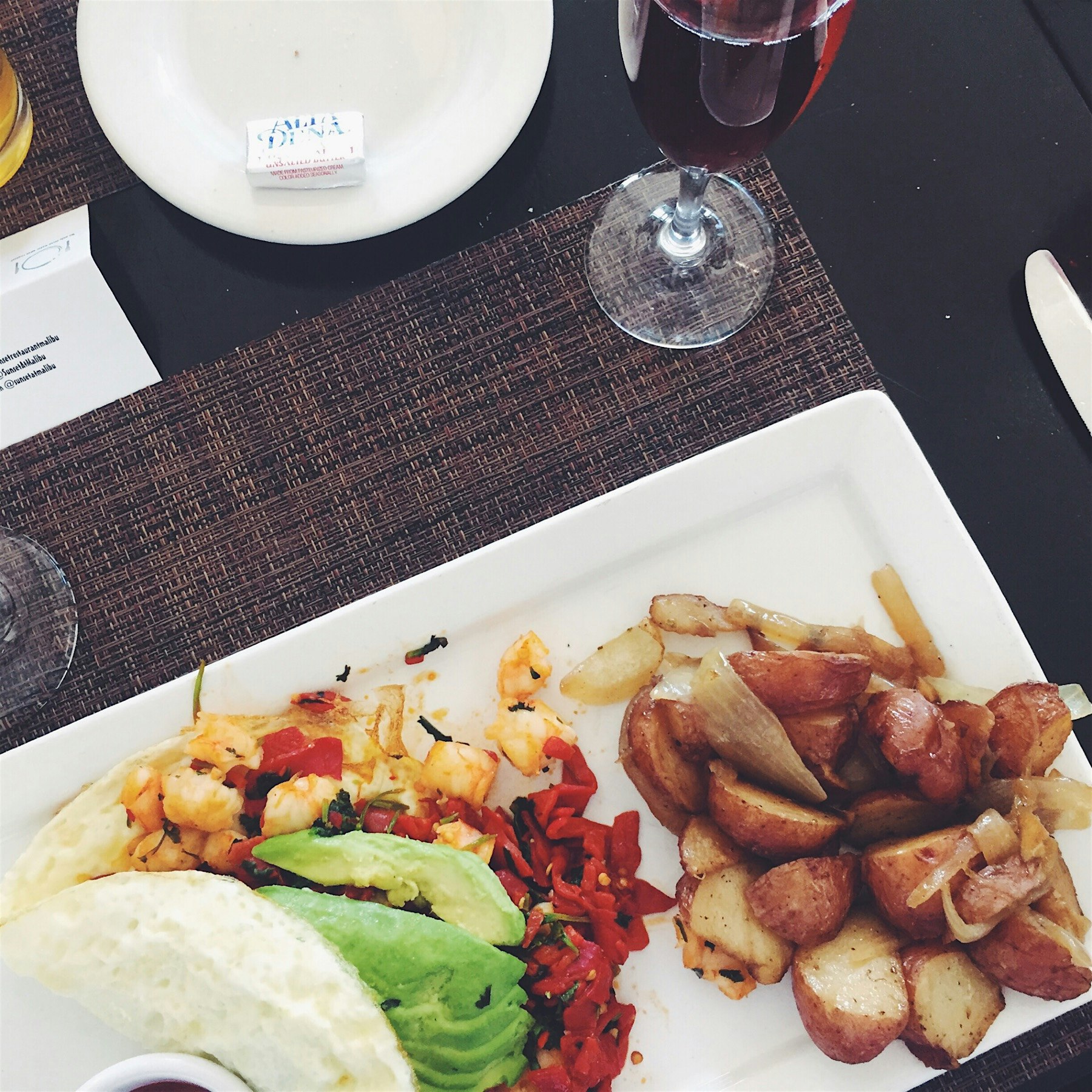 Omelet with piquillo peppers, avocado, and black tiger shrimp. The only thing better than the foo...