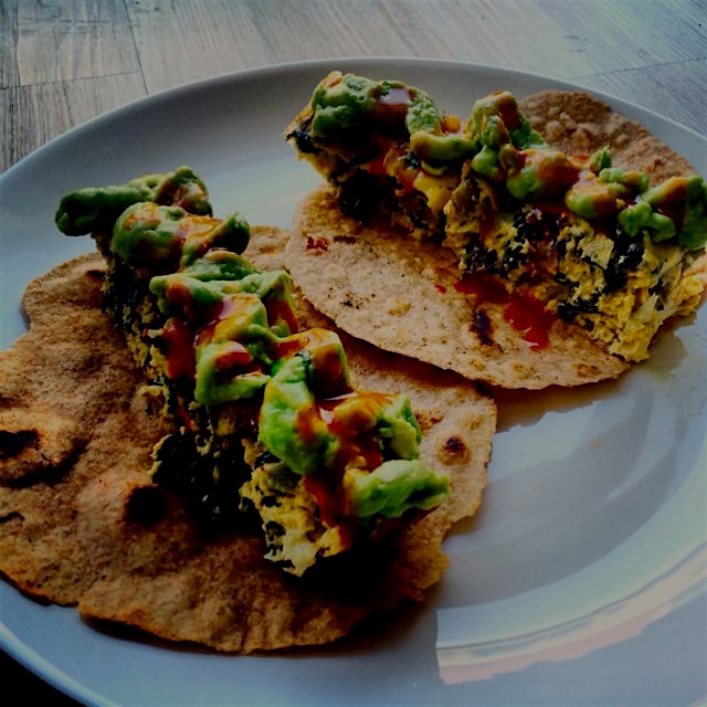 Breakfast tacos made with organic eggs, kale, mushroom, and Monterey Jack cheese. Wrapped in a ho...