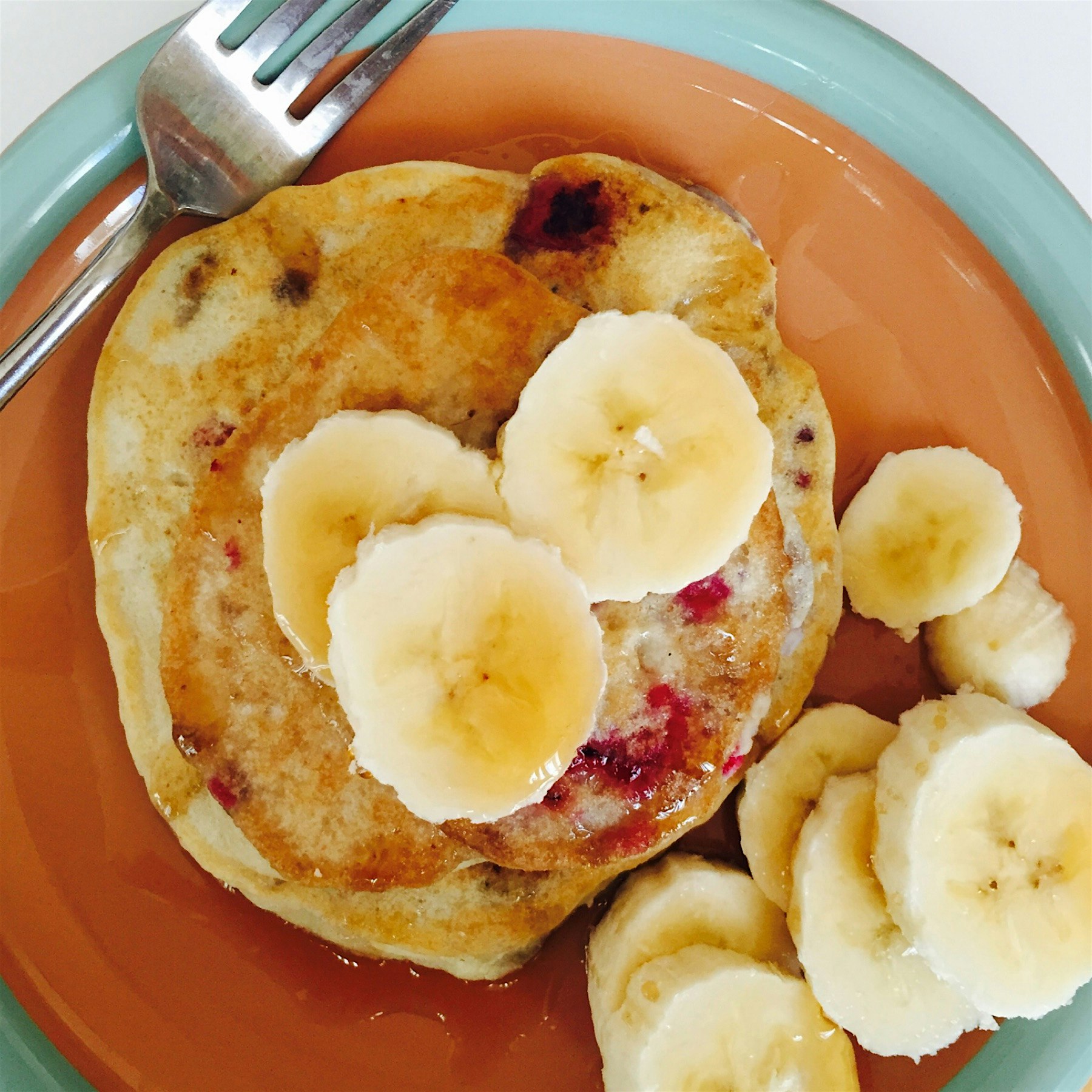 Excellent way to begin the new year: gluten-free raspberry banana pancakes. With coffee, lots of ...