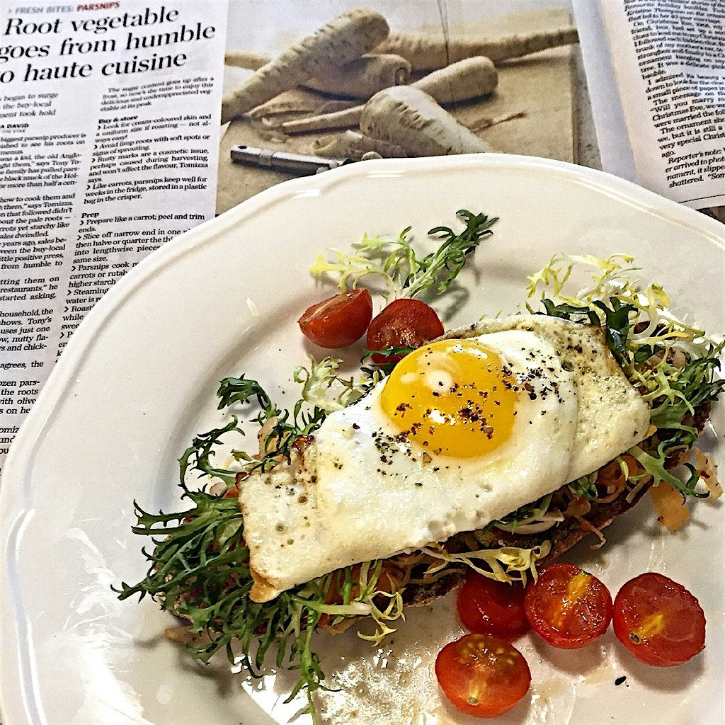 Starting off the week with a sunny side up egg on homemade rye, frisée and kimchi. And in other n...