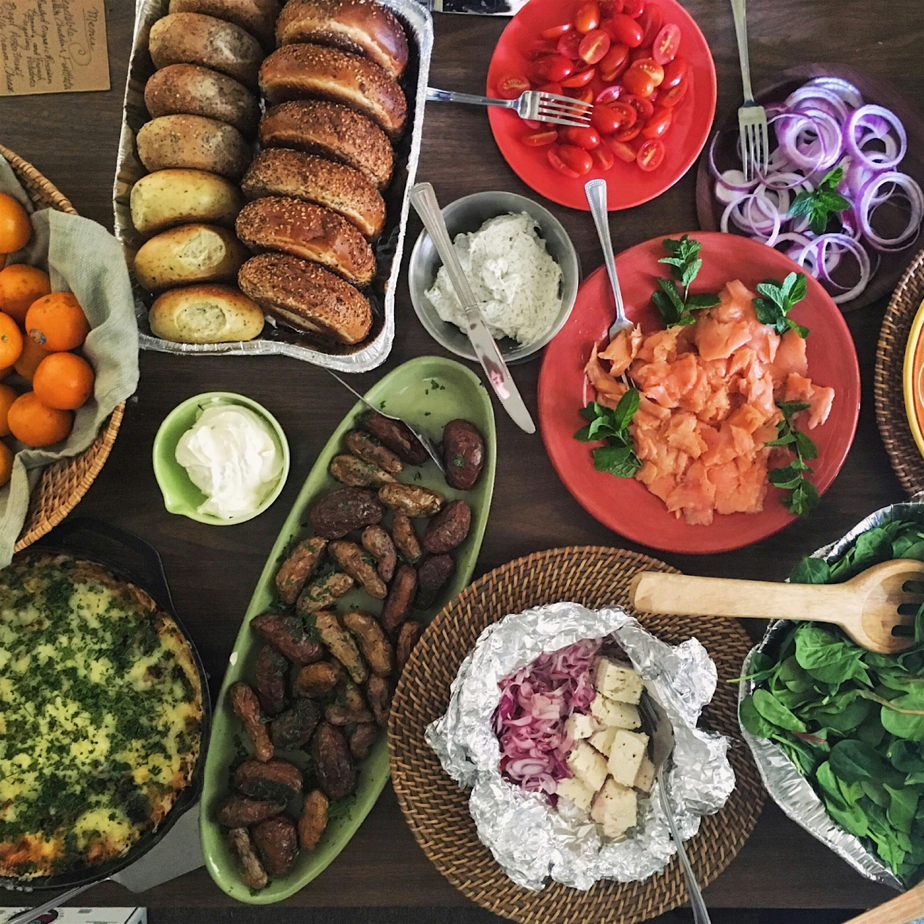 A lot of yum at our work lunch today. White cheddar frittata, roasted potatoes, Greek salad, blue...