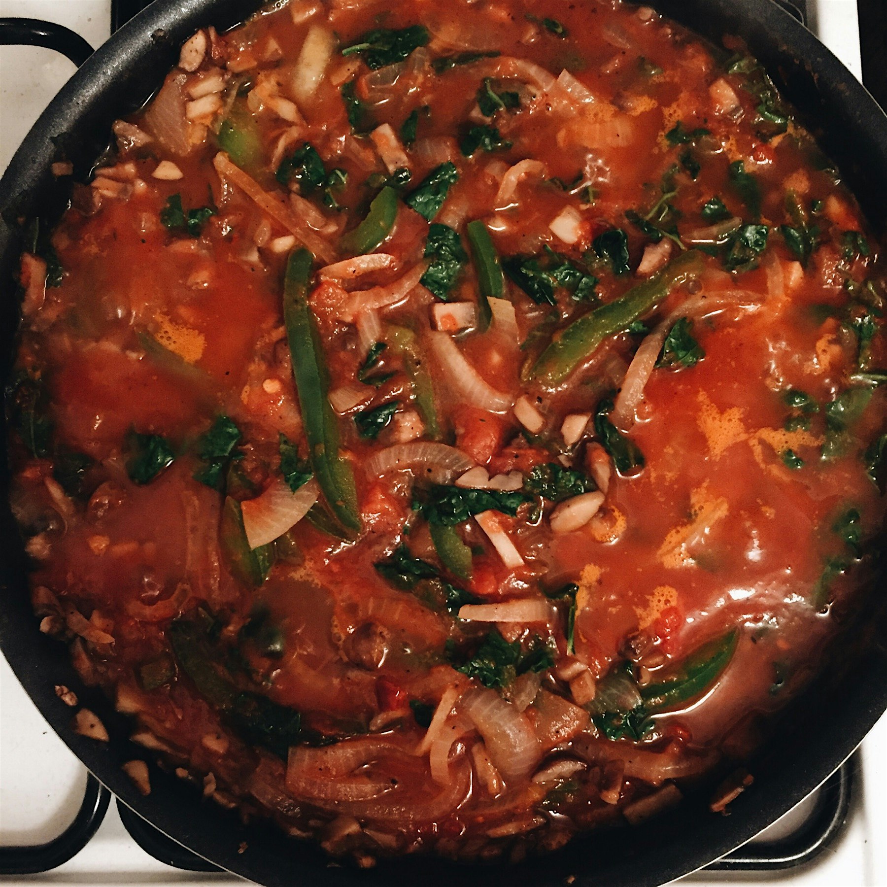 Cacciatore with kale simmering down on the stove top 🍅🌿