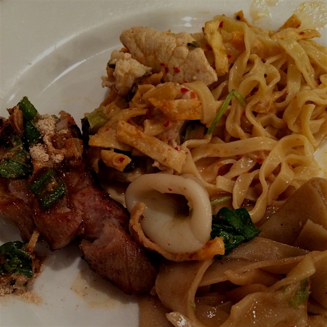 All the favorites were ordered at dinner at Lotus of Siam... Grilled marinated Pork, curry khao s...