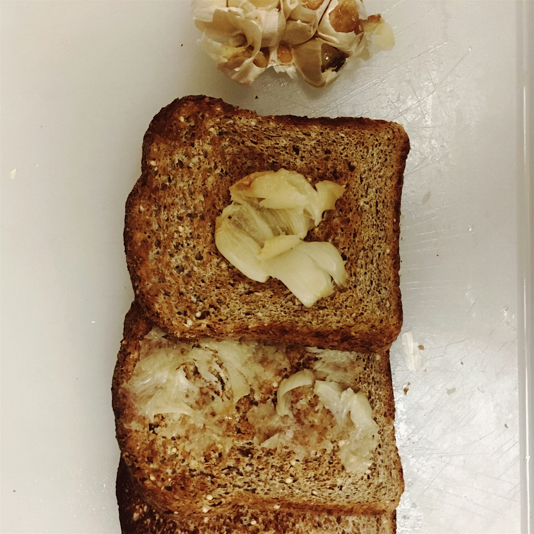 One of my favorite snacks: toast with roasted garlic. Keeps all the vampires away, too!