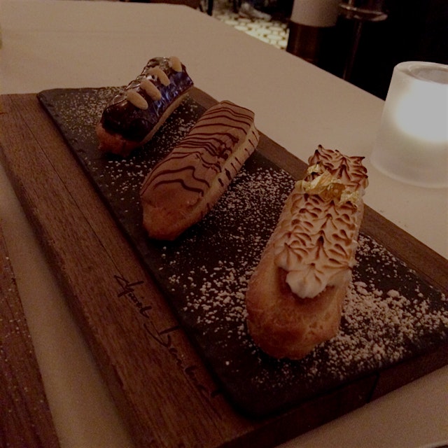 Trio of mini eclairs was presented along with a parade of other desserts - Chocolate-peanut butte...