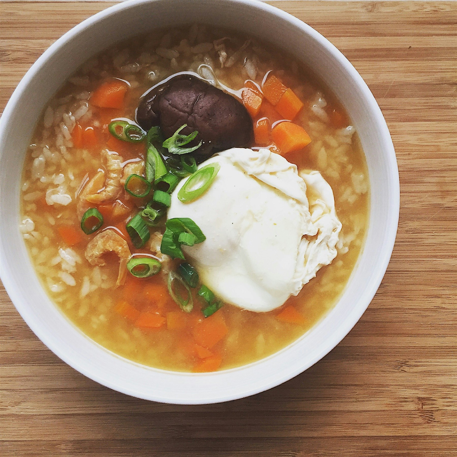 Quick rice porridge for breakfast: rice served in carrot miso broth, shiitake mushroom, dried shr...