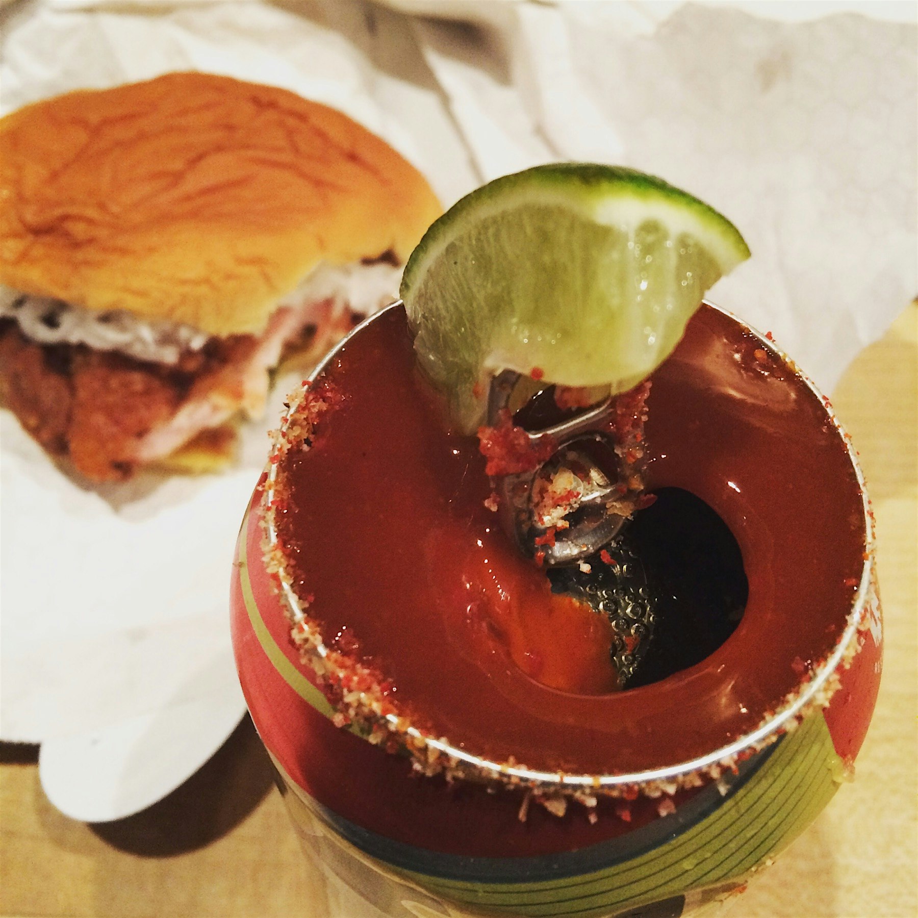 Washing down that spicy Chicken sandwich with a Michelada - a can of Tecate is topped with house ...