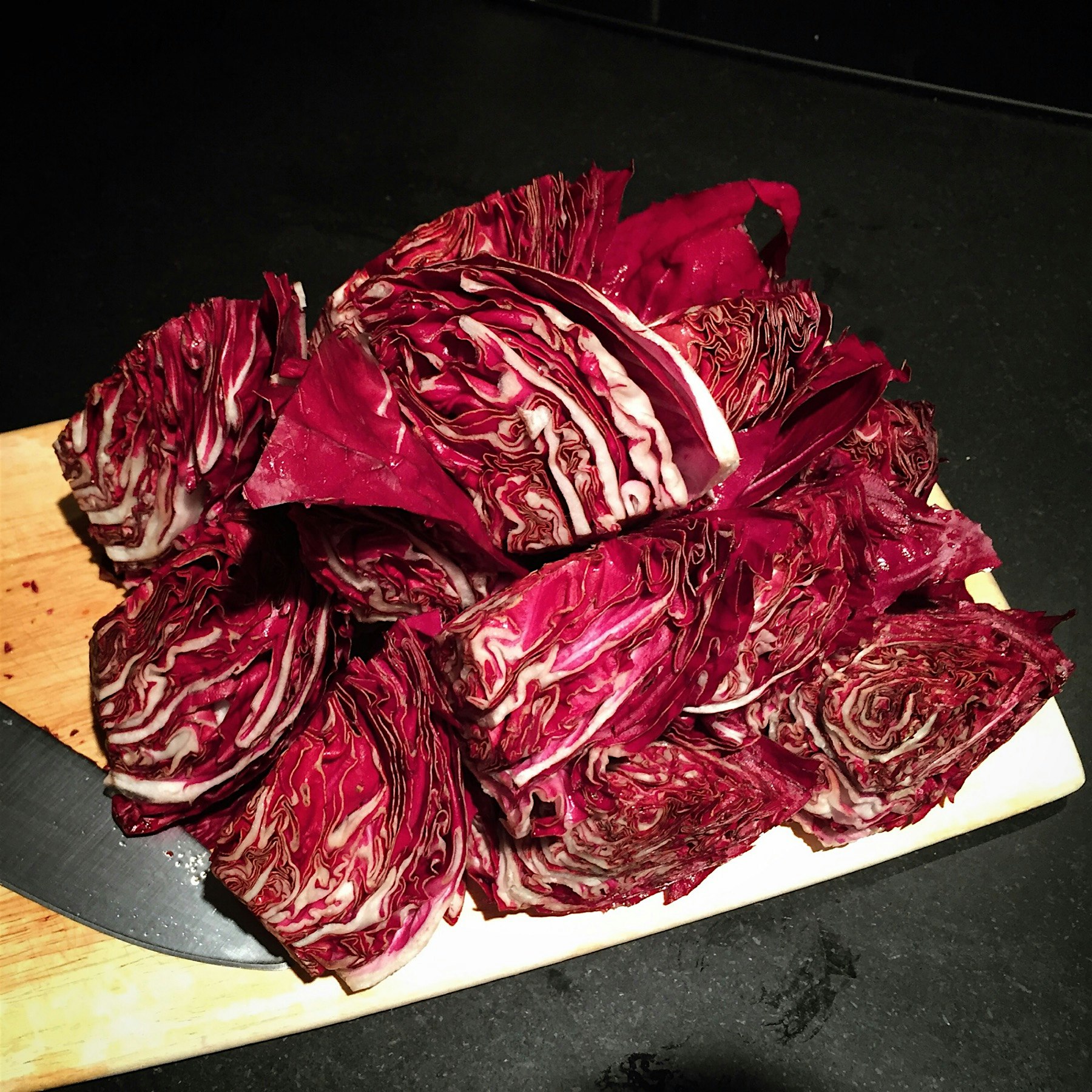 A pile of radicchio. Did you know that the most nutritious greens are the red and purple ones?