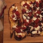 Made #ImpatientFoodie's two-ingredient pizza dough -- itself cribbed from #SlowRoastedItalian. And it works! Semi-luxury edition. White Moustache Greek yogurt and King Arthur flour dough, organic tomatoes, salted anchovies I filleted and jarred in oil myself -- and bodega mozz. 