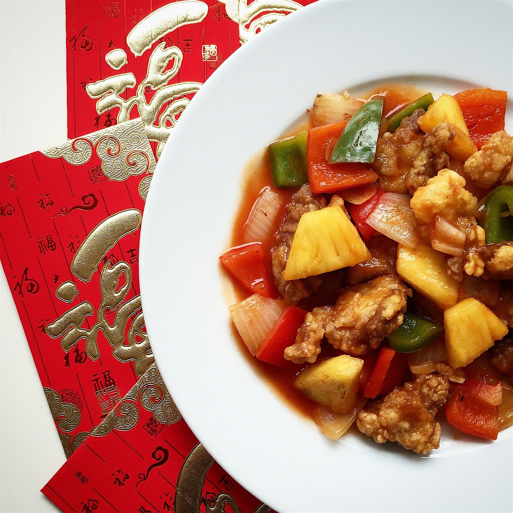 Happy Chinese New Year! Sweet and Sour Pork with Pineapple, one of our reunion lunch dishes. Wish...