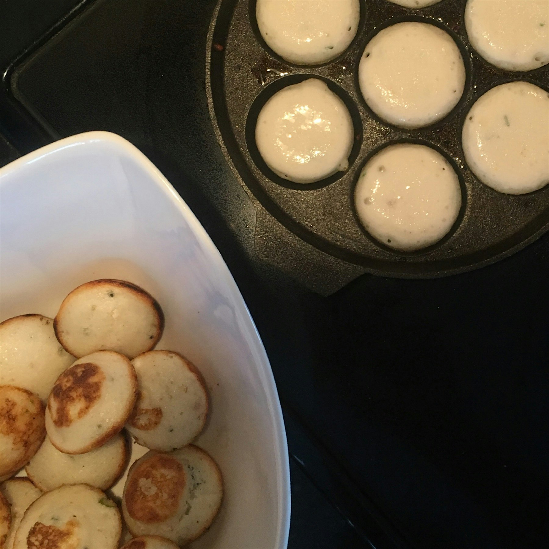 You use idli batter, temper seeds and spices with ginger and mix in the batter, and use a store t...