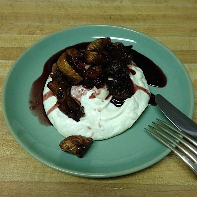 Homemade meringue topped with a red wine fig reduction flavored by cinnamon, cardamom and nutmeg.
