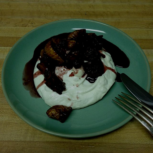 Homemade meringue topped with a red wine fig reduction flavored by cinnamon, cardamom and nutmeg.