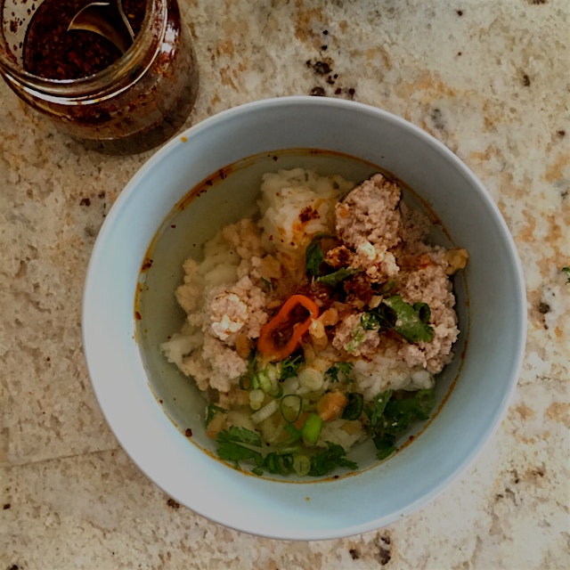 Khao Tom Moo - Homemade Thai rice soup traditionally eaten in the morning. This comforting dish i...