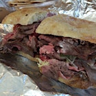 House made top round roast beef, tarragon mayo,
Iceberg lettuce and tomato on a roll. An enormous sandwich fit for a butcher! 