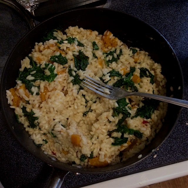 "Butternut squash and kale risotto is rich, comforting, and surprisingly healthy. Mix up a flavor...