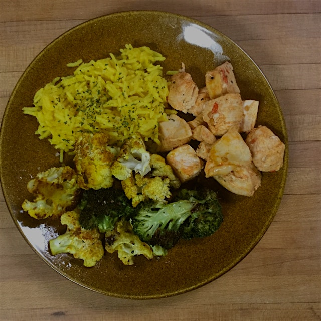 Harissa spiced chicken (organic) with yellow rice and roasted broccoli and cauliflower 