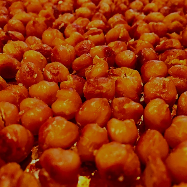 Roasted chickpea snack. Dry roast for 30 minutes at 400°. Toss with salt, curry powder (or whatev...