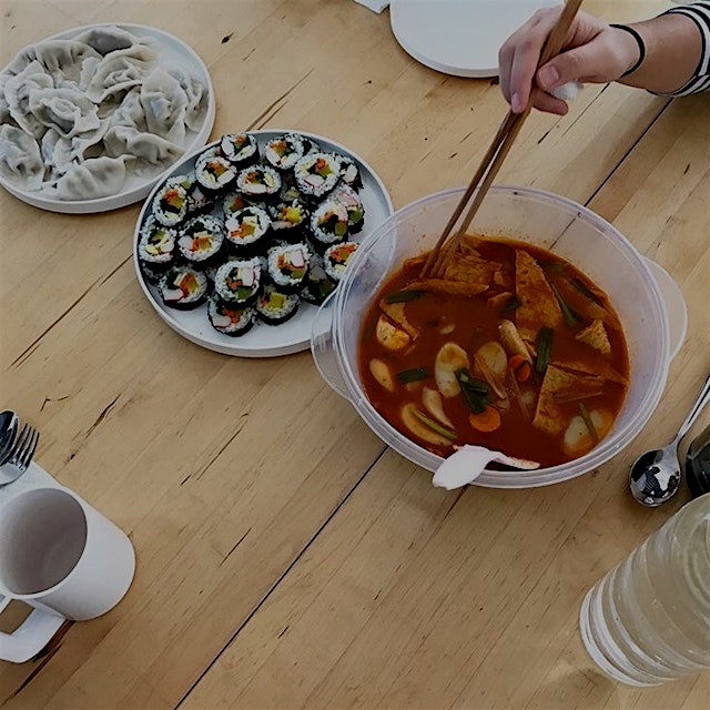 From left to right: 만두 (man-du) Korean dumplings, 김밥 (kim-bap), & 떡볶이 (tteok-bokk-i) spicy rice c...