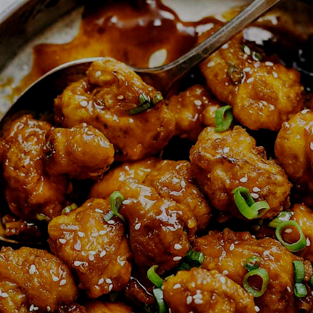 "General Tso's Cauliflower: golden brown crispy fried cauliflower tossed in a made-from-scratch s...