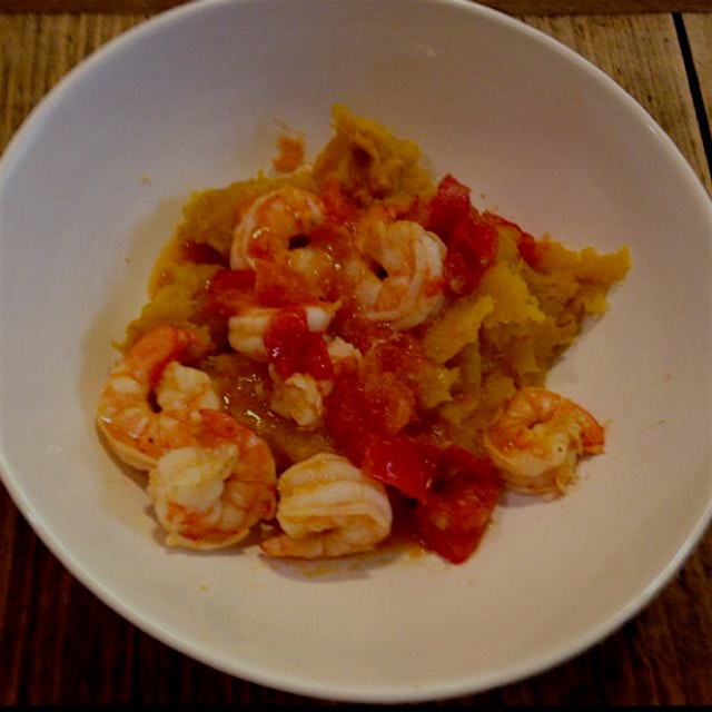 Shrimp sautéed in tomato, garlic, cumin, chilli, lime olive oil and salt over carnival squash. Wo...