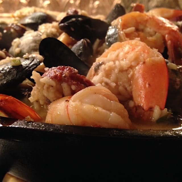My father's very own paella, served in our family's beloved Lodge pan with a room of great friend...