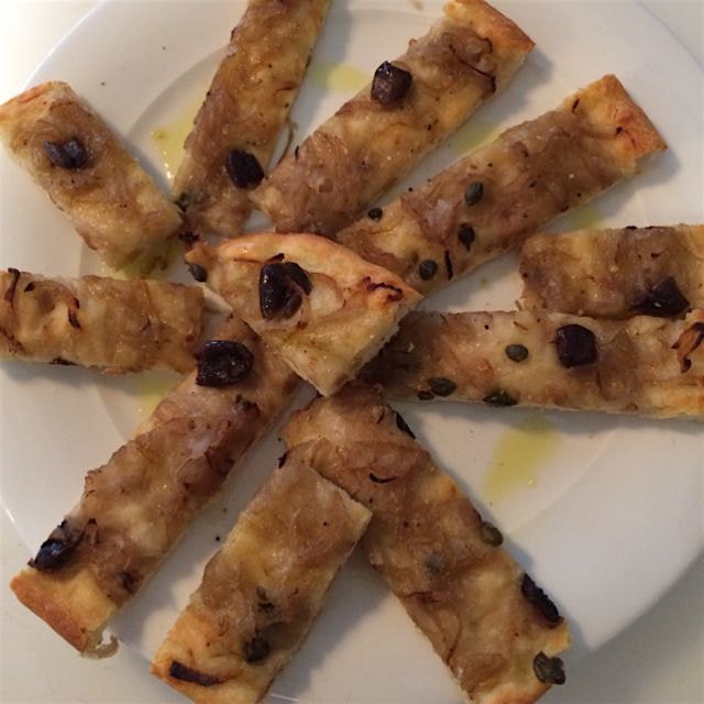 Focaccia time! With onions, capers and olives