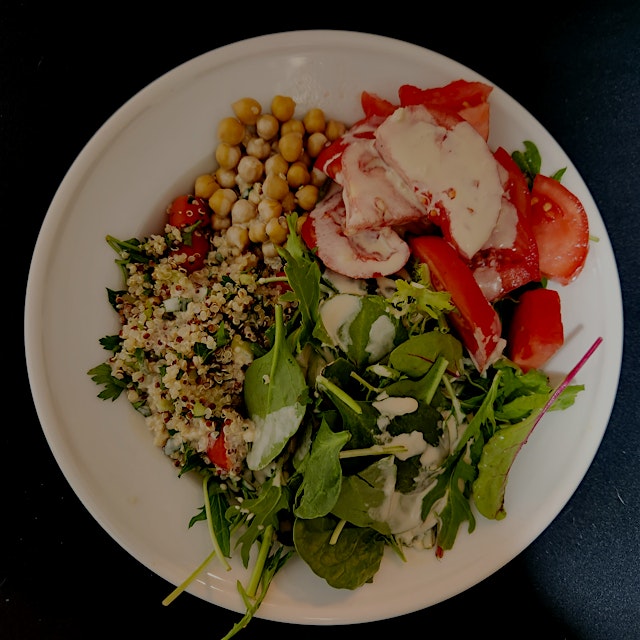 Elevating a plain lettuce and tomato salad with leftover tricolor quinoa and leftover chickpeas, ...