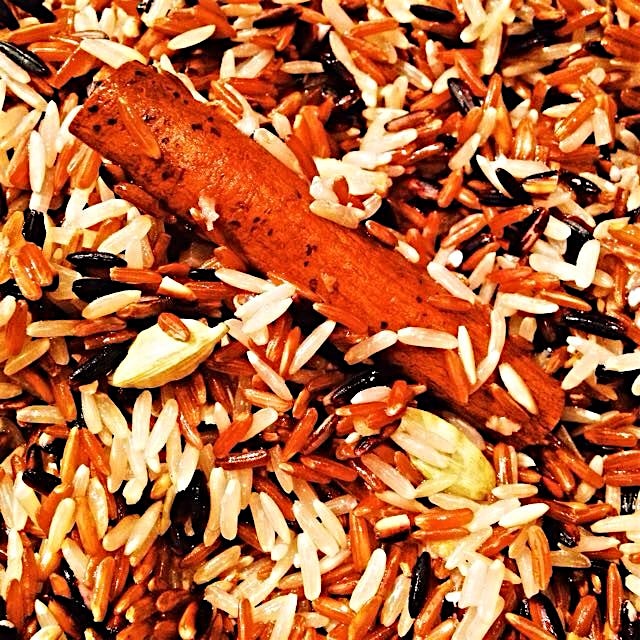 Sautéeing wild rice with ghee and spices before cooking. The house smells amazing. #thesamballady...