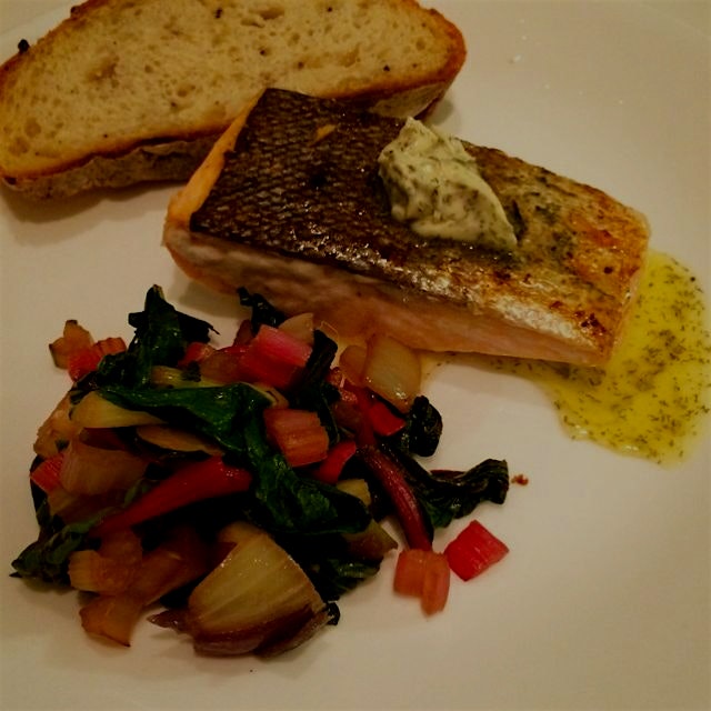 Salmon sautéed on its skin with herb butter and chard for dinner!
