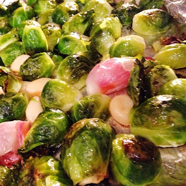 Brussels sprouts roasting with shallots and garlic. So yummy you forget they're good for you. #th...
