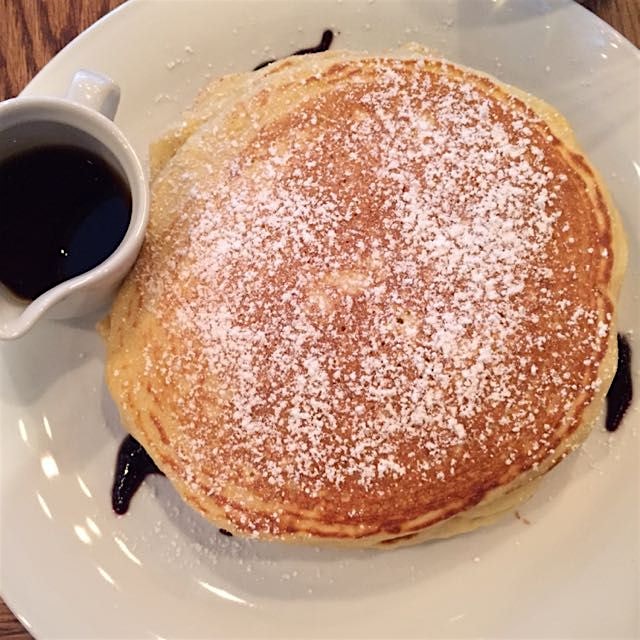 Lemon curd and ricotta pancakes with blueberry syrup at Chapter One!