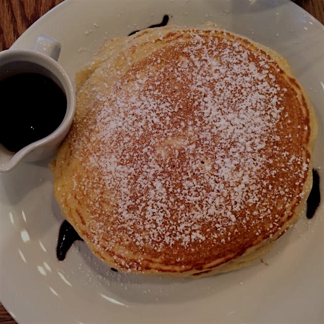 Lemon curd and ricotta pancakes with blueberry syrup at Chapter One!