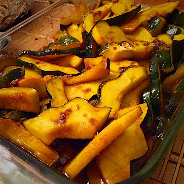Acorn squash roasted with maple syrup, brown sugar, and a nob of butter