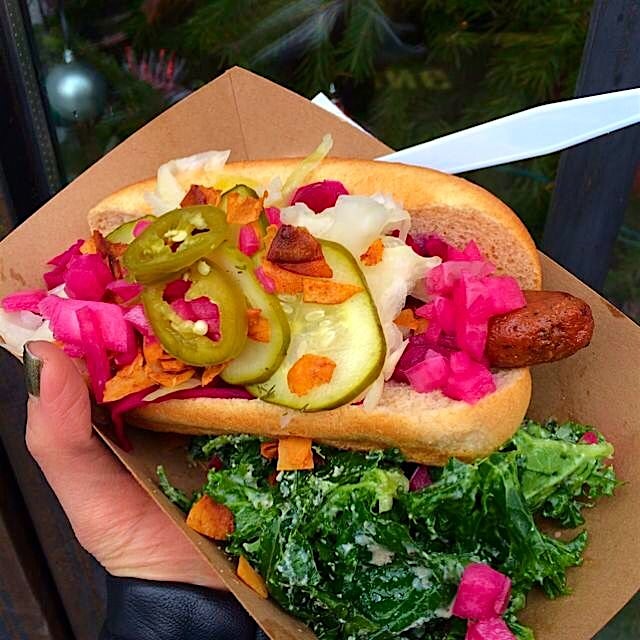 @yeahdawgnyc handmade vegan hot dogs loaded with homemade coconut bacon, pickles, kraut, and kale...