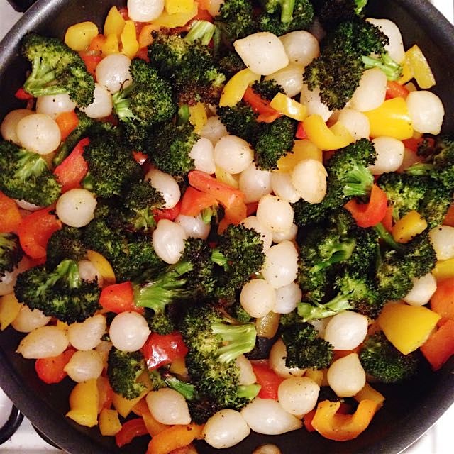 Prepping pasta primavera: roasted broccoli, bell peppers, pearl onions 