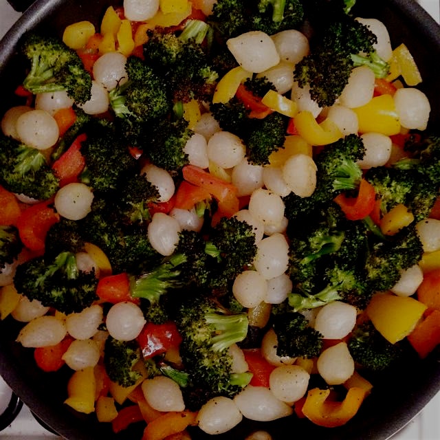 Prepping pasta primavera: roasted broccoli, bell peppers, pearl onions 