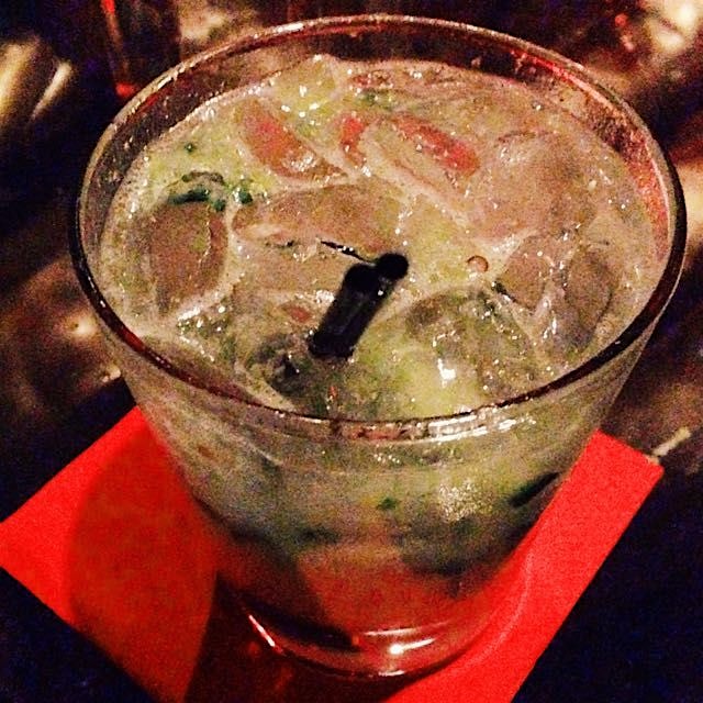 Spicy cucumber margarita with muddled serrano chiles & basil. 