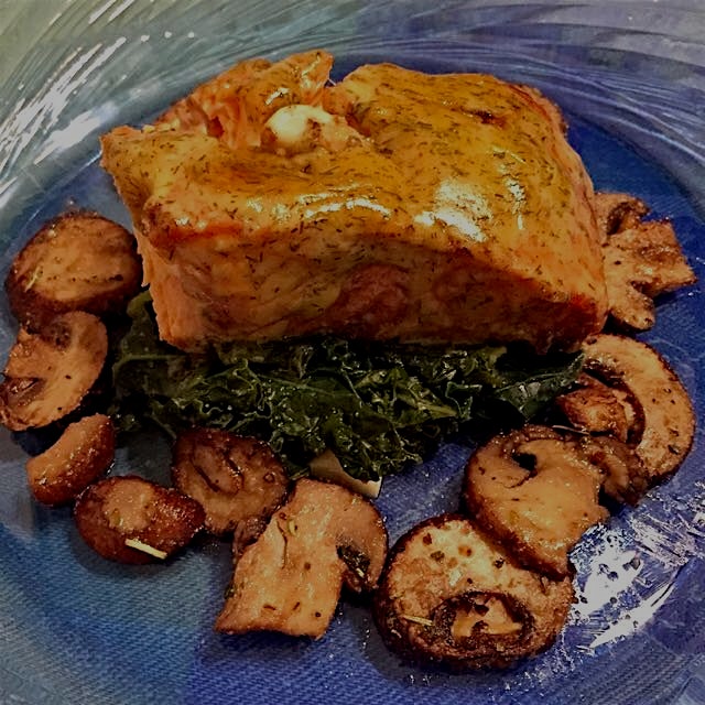 Mmmmmm. #balsamic marinated #salmon finished w a #dillsauce on a bed of garlic steamed #kale, wit...