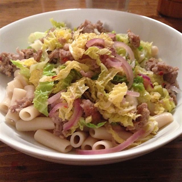 Italian sausage, Savoy cabbage, red onions, & cracked red pepper over gluten-free penne. @BlueApr...